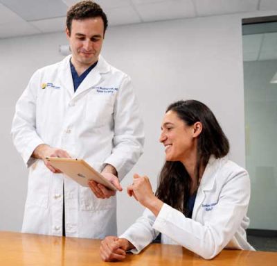 Dr. Farah Musharbash and Dr. Kimberly Ashayeri collaborate on spine treatment planning at Atlantic Brain and Spine.